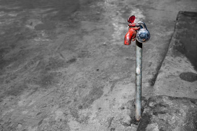 Human Right to Water in Mumbai - a locked water tap, portraying how precious water is for the residents of Dharavi – considered to be one of world's largest and most densely populated slums - with a population of about 700,000 living in an area of just about 2.1 square kilometers